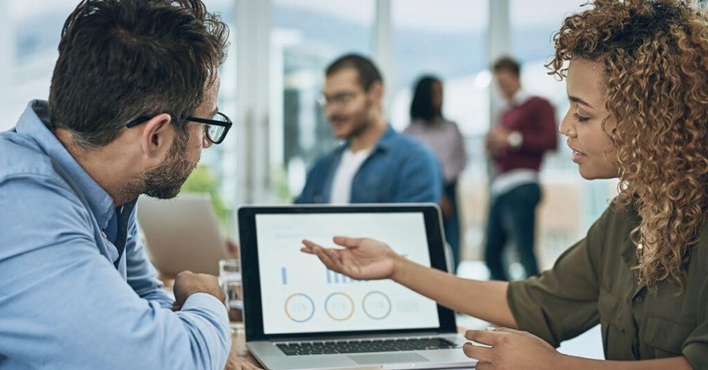 image of two developers talking about their new roles in ai-driven world