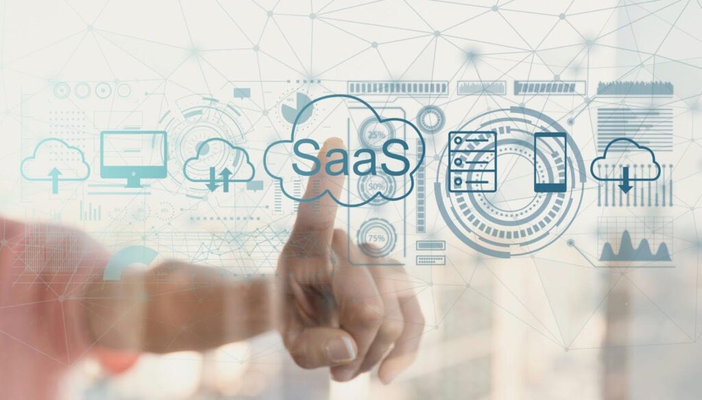 Finger touching a transparent screen with SaaS icons and cloud graphics, representing cloud application development, infrastructure, and app development cost insights.